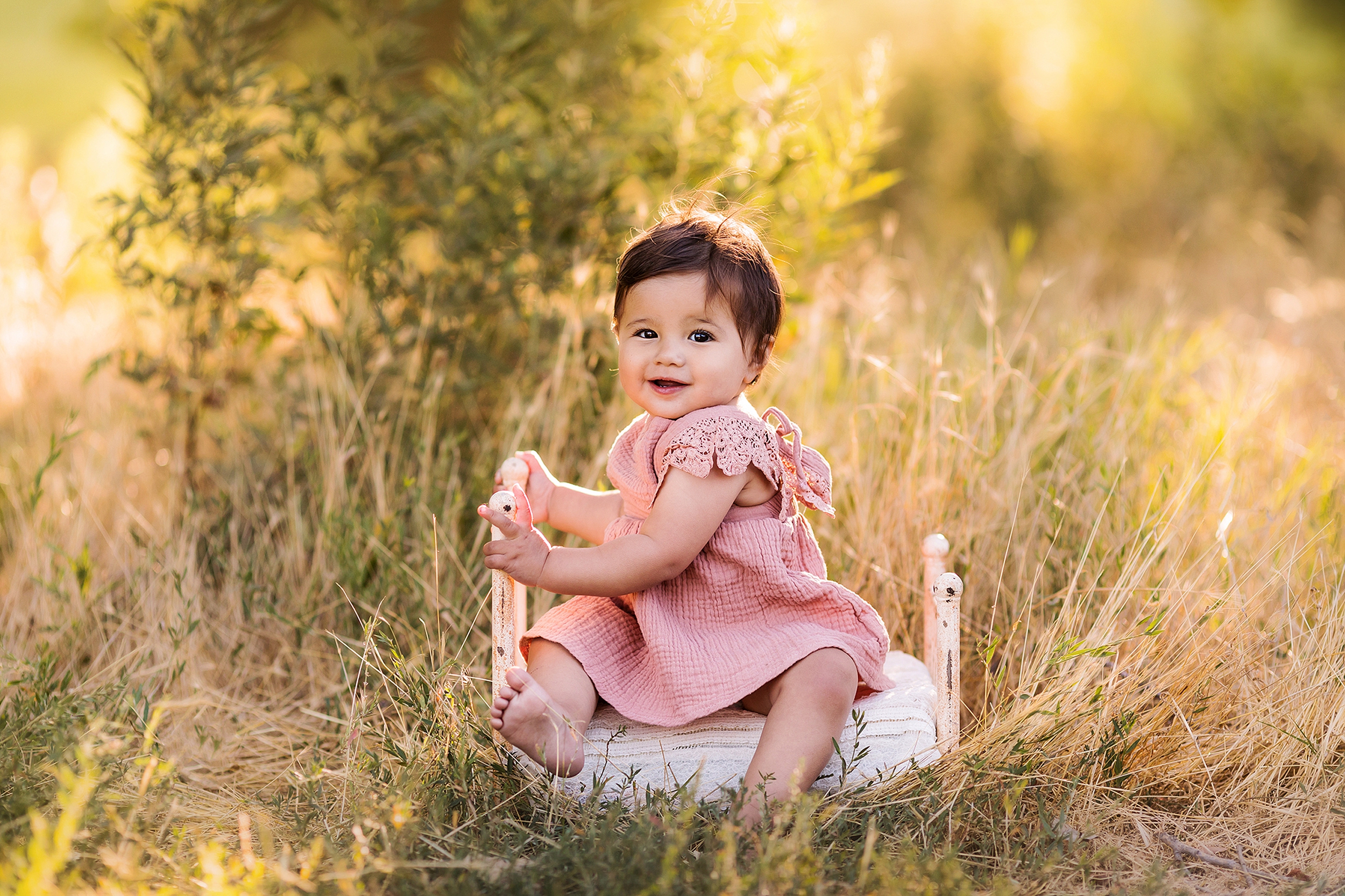 Little girl playing on a tiny bed outdoors by Los Angeles photographer A Pocket of Time Photography