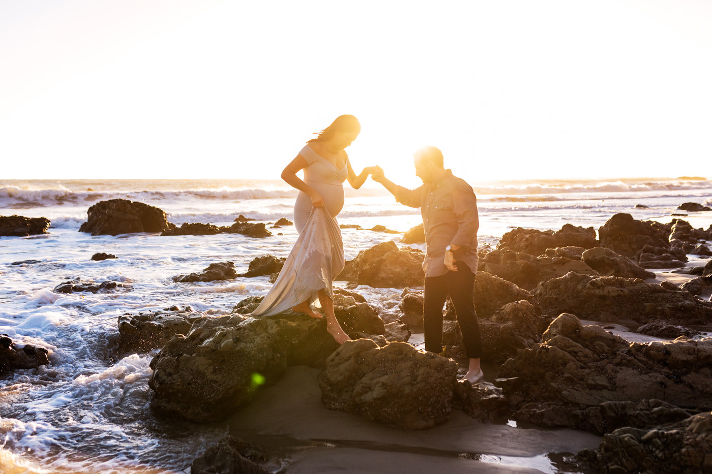 maternity photo of couple holding hands at the beach by los angeles maternity photographer a pocket of time photography